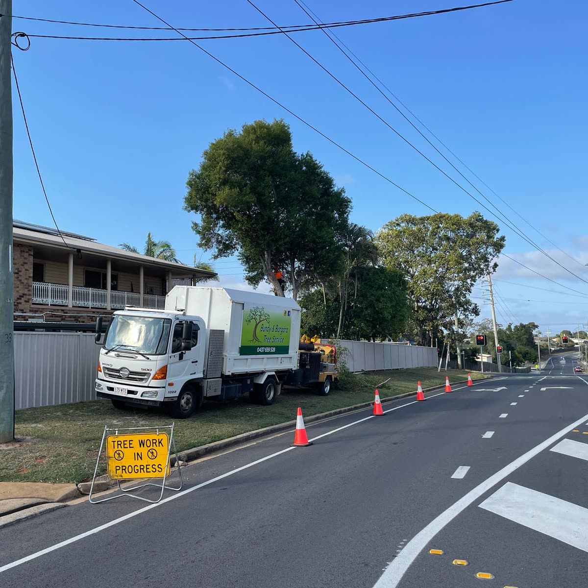Bundy & Bargara truck and cones with a tree work in progress sign on a Bundaberg street